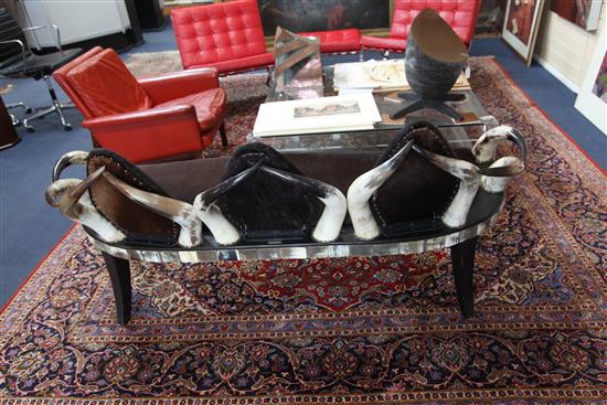 Anthony Redmile. An unusual cow horn and hide three seat settee, W.5ft 8in.